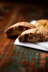 Cantuccini (Italian cookies) on dark wooden background. Close up	
