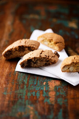 Cantuccini (Italian cookies) on dark wooden background. Close up	