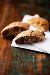 Cantuccini (Italian cookies) on dark wooden background. Close up	