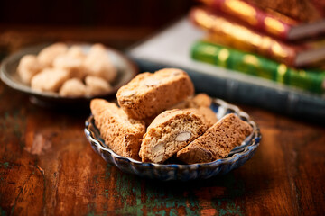 Cantuccini (Italian cookies) on dark wooden background. Close up	