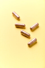 Carnitine capsules. Concept for a healthy dietary supplementation. Bright paper background. Soft focus. Close up.	