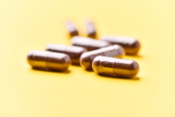 Lutein capsules. Dietary supplement on bright background. Soft focus. Close up. Copy space	