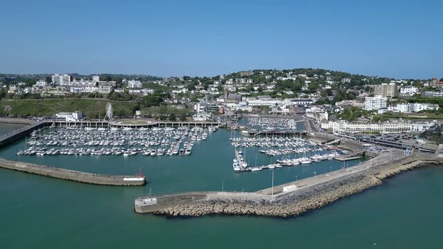 Torquay, Torbay, Devon, England: DRONE VIEWS: The drone shows boats and yachts moored inside Torquay marina as well as the marina entrance. Torbay is a popular UK holiday destination.