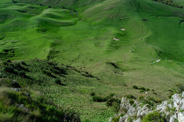Aerial View of Lush Green Hills and Slopes