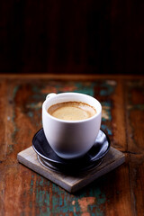 Cup of coffee on wooden background. Soft focus. Copy space	