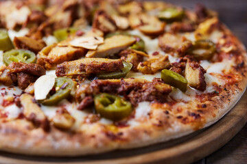 Gyros Pizza with jalapeno pepper and mozzarella cheese. Soft focus. Close up.	