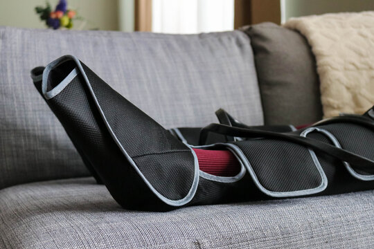 Air compression leg massager on the couch