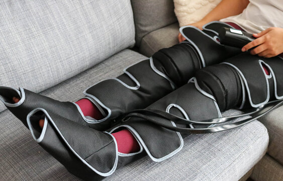 Full view of air compression boots in use