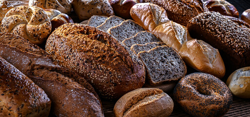 Assorted bakery products including loaves of bread and rolls