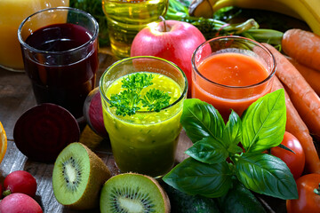 Glasses with fresh organic vegetable and fruit juices