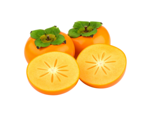 Group of ripe orange persimmons with green calyxes one fruit cut in half showing the starlike core.