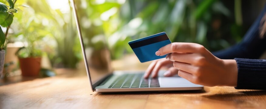 The seamless online shopping experience with a credit card in hand.