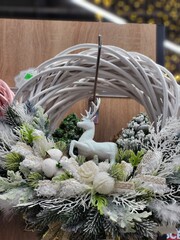White Christmas wreath with deer figure