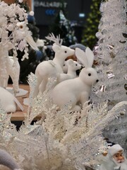 White decorative rabbits in winter scenery
