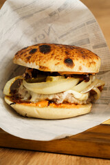 Beef burger with grilled onions and fries