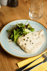 Chicken breast in creamy caper sauce