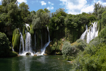 Fototapeta premium cinematic shot of waterfall kravice