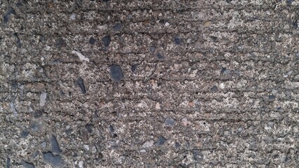 Rural road surface, rough grey cement