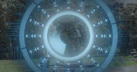 Overlaying translucent scanning HUD over park lawn, with concentric rings and triangular arrows