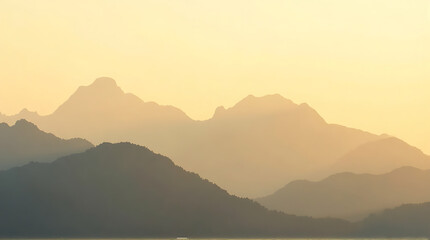 Obraz premium Spectacular Mountain Range Silhouettes Bathed in the Warmth of a Golden Sunset