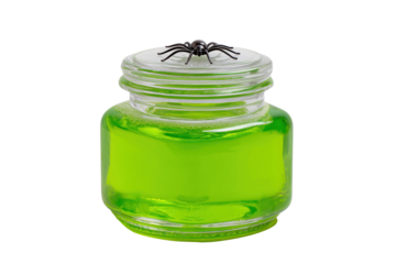 Glass jar filled with bright green liquid and a black spider on lid isolated on a transparent background