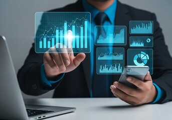 Photo of businessman analyzing financial data on a futuristic digital interface with charts and graphs, using a laptop and smartphone for business analytics