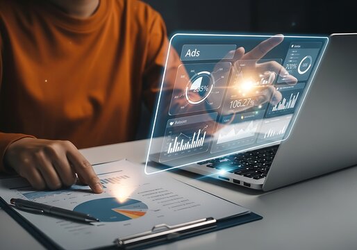 Photo of person analyzing financial data and business growth on a futuristic digital interface with charts and graphs on a laptop screen