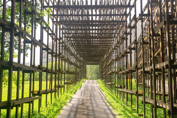 wooden roof over the bike path in the park, protects against possible falling wire of power lines