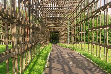 wooden galleries over the bike paths in the park, protects against possible falling wire of power lines