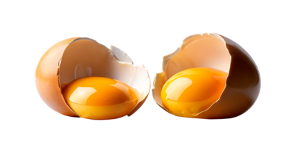 Two Broken Brown Eggs with Bright Yellow Yolks Isolated on Black Background