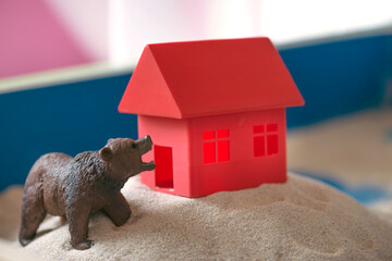 The concept of psychology. Sand therapy. A bear figurine in a blue sandbox. Psychology. Therapy. POST-TRAUMATIC STRESS DISORDER. Confrontation. Aggression. PTSD.