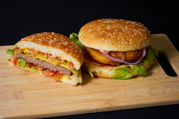 Juicy Hamburger with Lettuce and Onion on Board