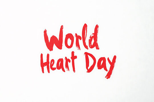 Celebrating World Heart Day with bold red lettering against a clean white background, promoting awareness and care for cardiovascular health globally. - Powered by Adobe