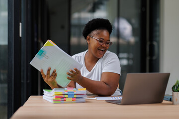 Accountant African American businesswoman holding Business Documents data contract partner working at desk in the office. 
