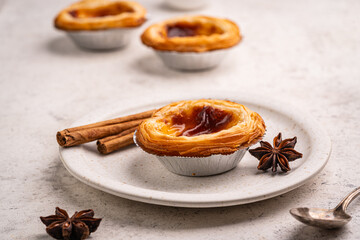 Traditional Portuguese custard tarts or Pastel de Nata freshly baked cream dessert. High quality photo