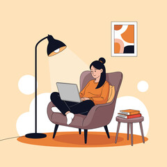 A young woman focused on her laptop while sitting in a comfortable armchair illuminated by a floor lamp in a cozy living room