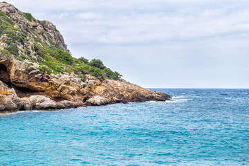 Iero beach cove shore coast by birthplace of Greek god Dionysos or Dyonysus temple on Ikaria island Greece by Ikarian sea cliff