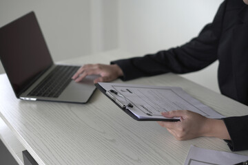 Fototapeta premium Young asian businesswoman employer holds resume and talks with candidate for recruitment interview process about the career and personal job history in company, recruitment, employment and HR concept.