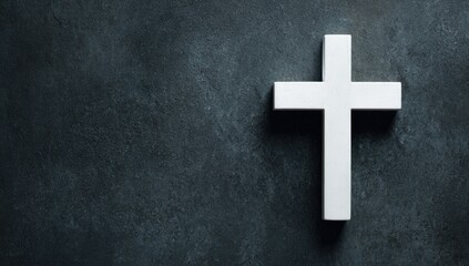 Simple white cross on dark textured surface