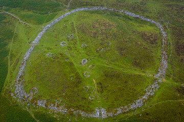Aerial photo of Bronze Age settlement remains at Grimespound, Dartmoor, showing circular enclosures and stone structures on open moorland