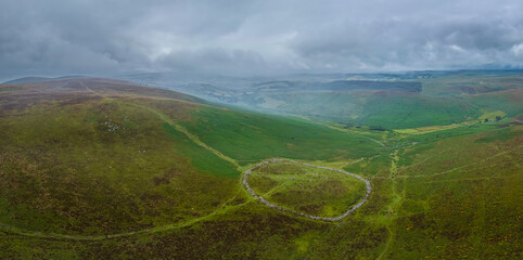 Aerial photo of Bronze Age settlement remains at Grimespound, Dartmoor, showing circular enclosures...