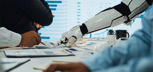 A dynamic scene showcasing robots and humans working together in an office, emphasizing the integration of advanced technology with data analysis and teamwork.Noogenesis