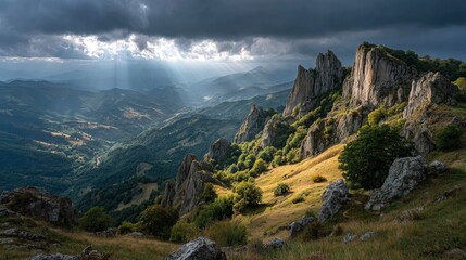 Dramatic cliffs and rocky outcrops under a stormy sky scenic mountain landscape with rays of sunlight breaking through the clouds