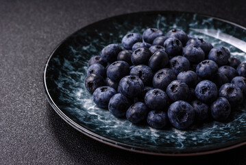Fresh juicy blueberries, healthy vegan food with vitamins and minerals. Blueberries berry