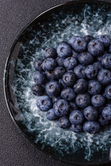 Fresh juicy blueberries, healthy vegan food with vitamins and minerals. Blueberries berry