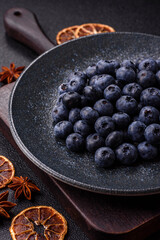 Fresh juicy blueberries, healthy vegan food with vitamins and minerals. Blueberries berry