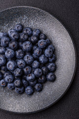 Fresh juicy blueberries, healthy vegan food with vitamins and minerals. Blueberries berry