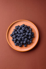Fresh juicy blueberries, healthy vegan food with vitamins and minerals. Blueberries berry