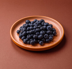 Fresh juicy blueberries, healthy vegan food with vitamins and minerals. Blueberries berry