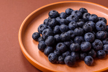 Fresh juicy blueberries, healthy vegan food with vitamins and minerals. Blueberries berry